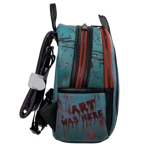 Backpack with blue and black design and text 'ART WAS HERE' on a white background